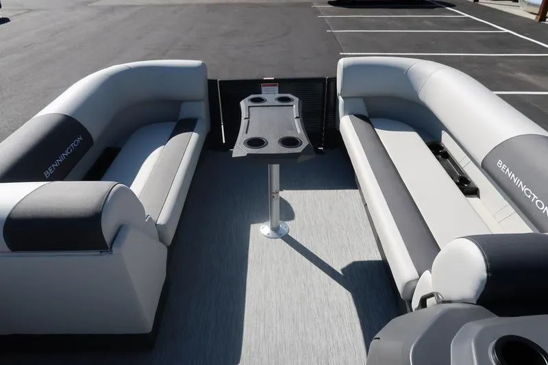 Slide: The Image of 2026 Bennington S Swingback 22 SSB boat interior with sleek seating and cup holders. - 19