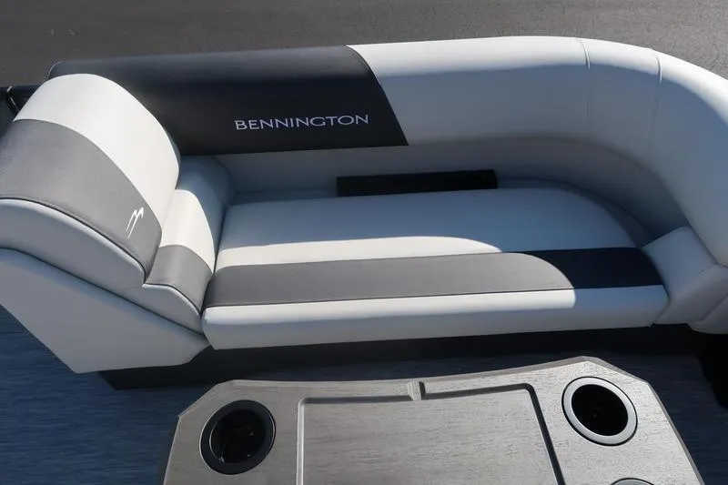 Slide: The Image of 2026 Bennington S Swingback 22 SSB boat interior with stylish seating and cup holders. - 23