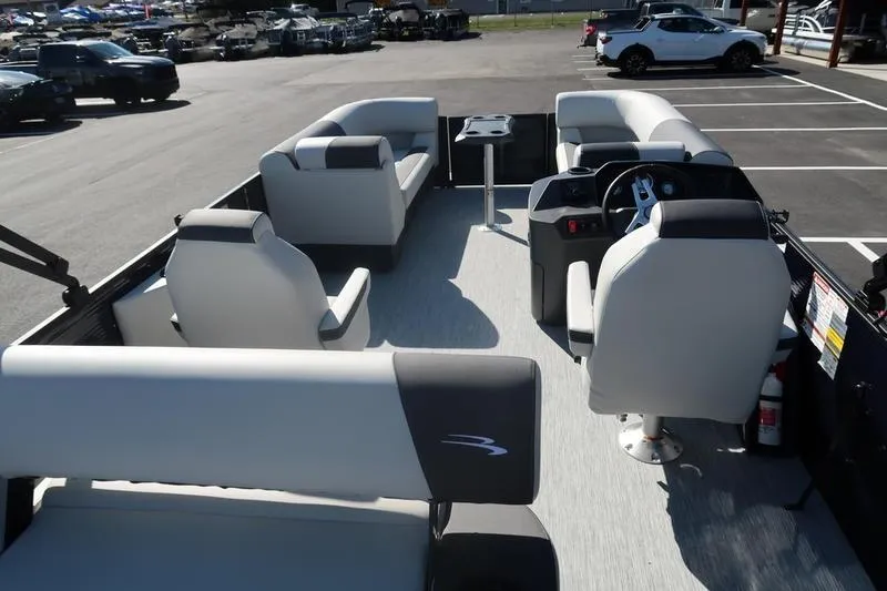 Slide: The Image of 2026 Bennington S Swingback 22 SSB pontoon boat, rear view in parking lot. - 8