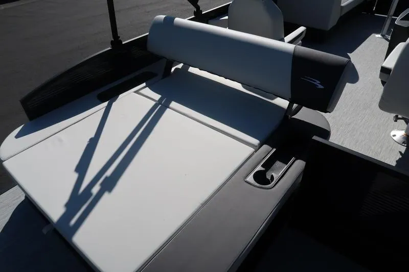 Slide: The Image of 2026 Bennington S Swingback 22 SSB pontoon boat parked outdoors on a sunny day. - 9