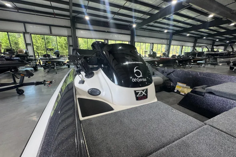 Slide: The Image of 2011 Skeeter ZX225 boat in showroom, featuring sleek design and advanced equipment. - 10