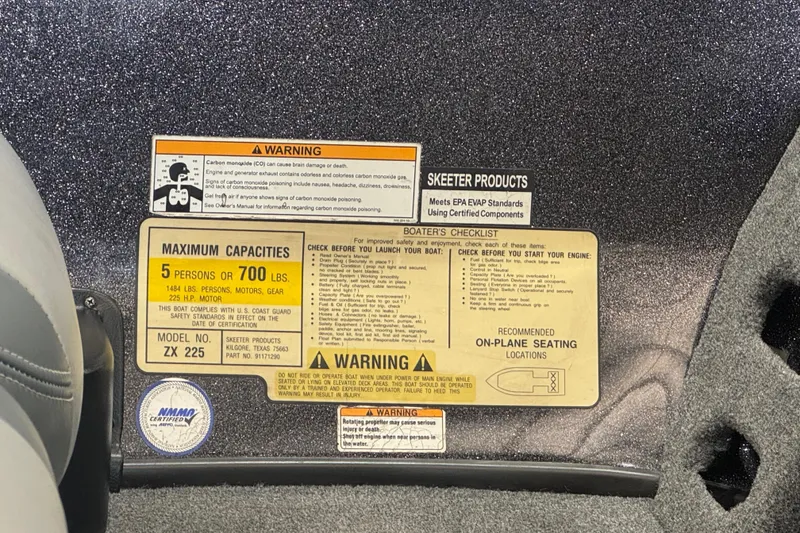 Slide: The Image of 2011 Skeeter ZX225 boat capacity and safety warning labels. - 4