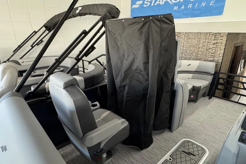 Slide: The Image of 2026 Starcraft EXS 3 boat interior with seating and privacy curtain. - 10