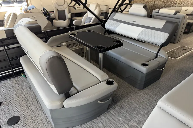 Slide: The Image of Luxurious interior of 2026 Starcraft EXS 3 boat with plush seating and table. - 11
