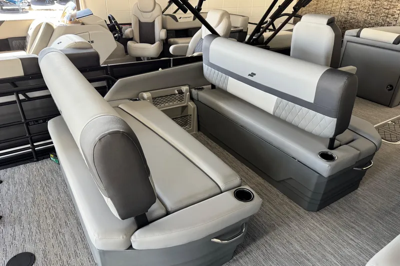 Slide: The Image of 2026 Starcraft EXS 3 boat interior with gray seating and cup holders. - 12