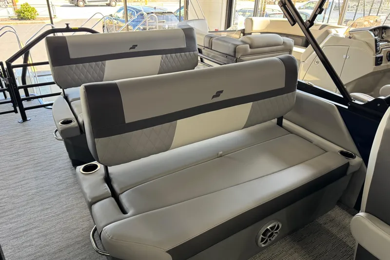 Slide: The Image of 2026 Starcraft EXS 3 boat interior with gray seating and cup holders. - 13