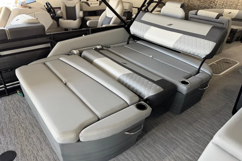 Slide: The Image of 2026 Starcraft EXS 3 boat interior with luxurious gray seating and cup holders. - 14