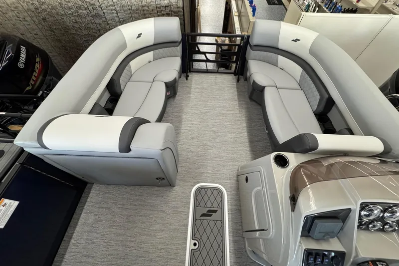 Slide: The Image of 2026 Starcraft EXS 3 boat interior with gray seating and modern dashboard. - 3