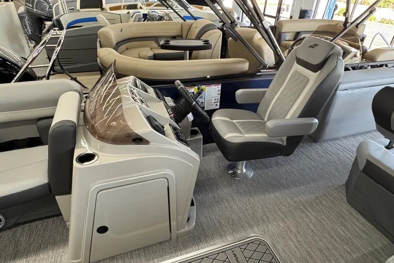 Slide: The Image of Interior of a 2026 Starcraft EXS 3 boat with modern seating and control console. - 6