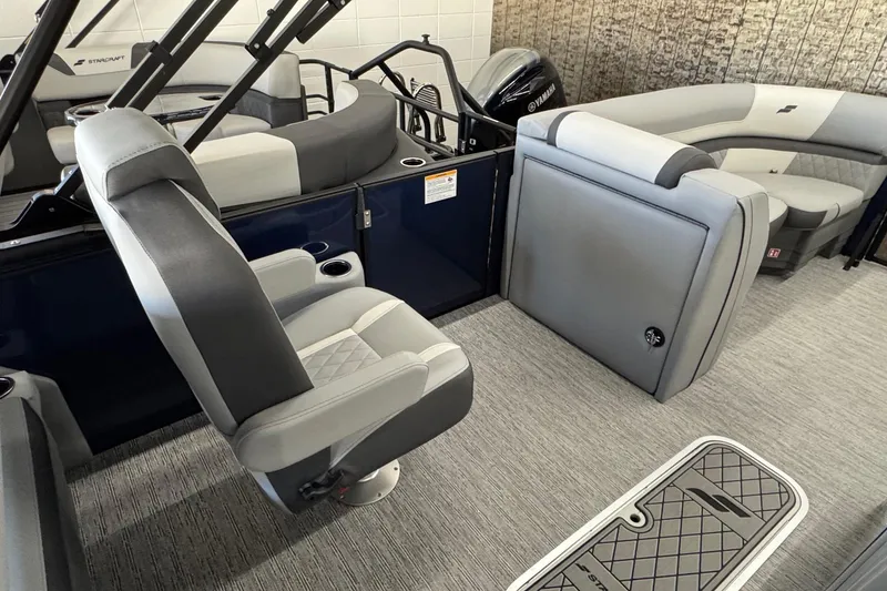 Slide: The Image of 2026 Starcraft EXS 3 boat interior with gray seating and modern design. - 9