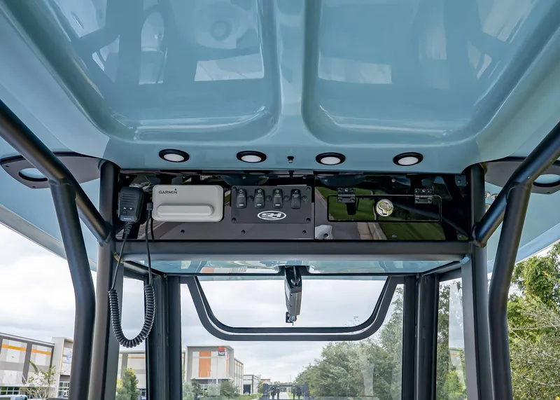 Slide: The Image of 2026 Sea Hunt BX 25 FS boat console with Garmin electronics and overhead storage. - 13