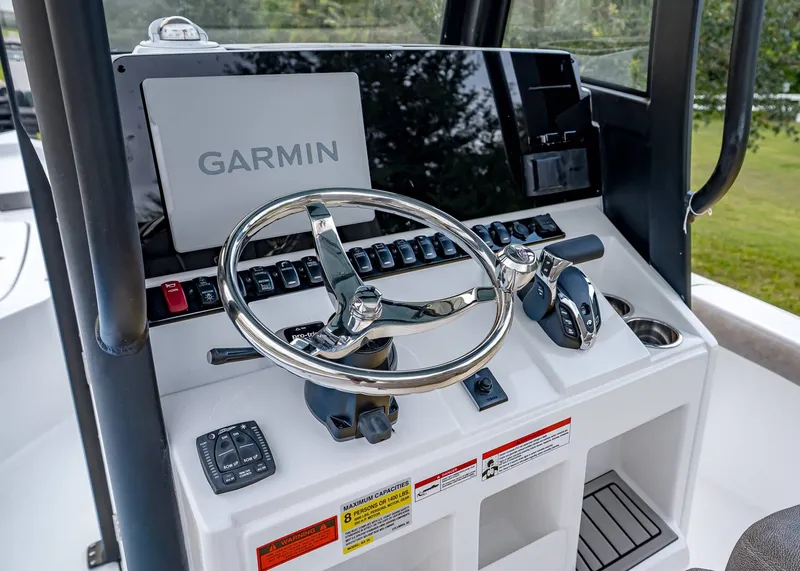 Slide: The Image of 2026 Sea Hunt BX 25 FS boat console with Garmin navigation system and steering wheel. - 14