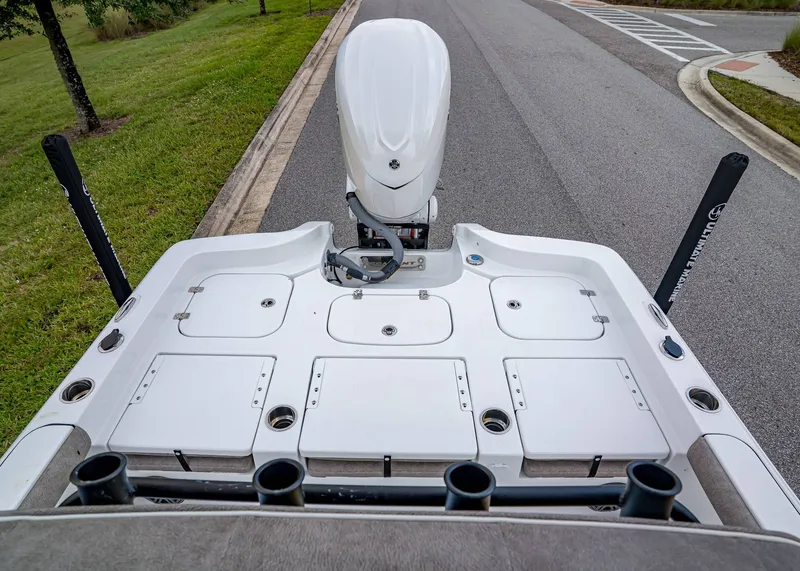 Slide: The Image of 2026 Sea Hunt BX 25 FS boat with outboard motor on a road. - 5