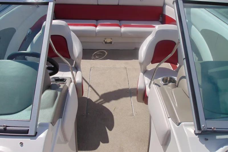 Slide: The Image of Interior of 2013 Crownline 235 SS boat with red and white seating. - 13