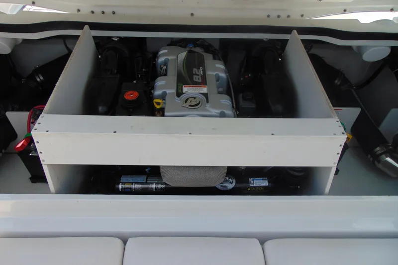 Slide: The Image of Engine compartment of 2013 Crownline 235 SS boat, showcasing a MerCruiser engine. - 19