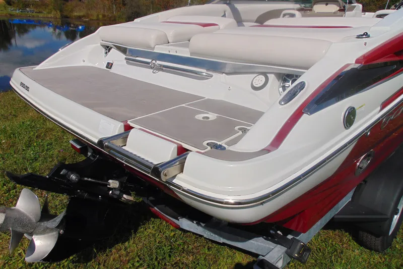 Slide: The Image of 2013 Crownline 235 SS boat rear view with swim platform and propeller. - 5