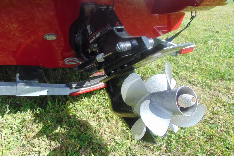 Slide: The Image of 2013 Crownline 235 SS boat propeller and stern drive on grass. - 6
