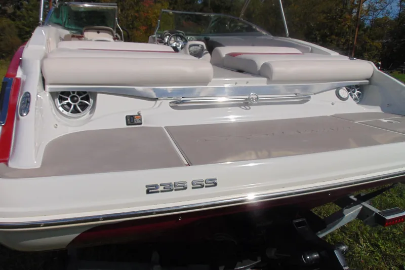 Slide: The Image of 2013 Crownline 235 SS boat rear view with speakers and seating. - 7