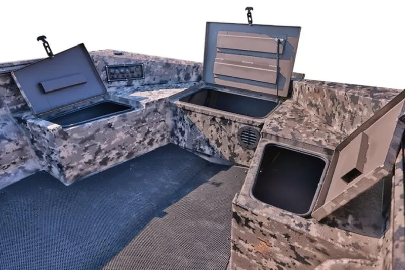 Slide: The Image of 2025 Havoc 1656 boat interior with camo design and multiple storage compartments. - 8
