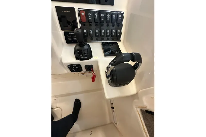 Slide: The Image of 2019 Grady-White Freedom 325 boat control panel with Yamaha joystick and throttle. - 11