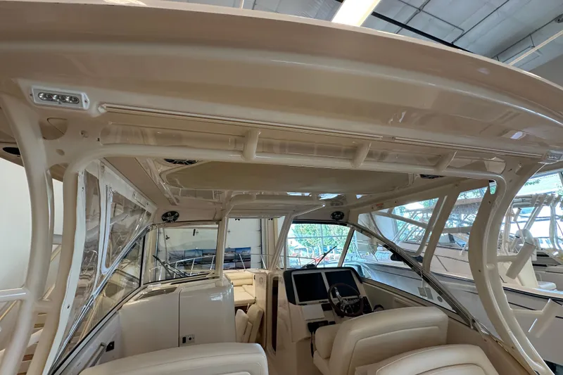 Slide: The Image of 2019 Grady-White Freedom 325 boat interior with helm and seating area. - 18