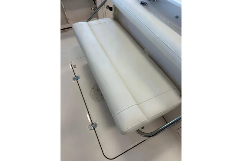 Slide: The Image of 2019 Grady-White Freedom 325 boat seat, white upholstery, sleek design. - 19