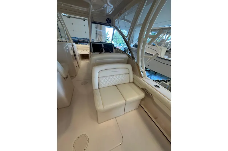 Slide: The Image of 2019 Grady-White Freedom 325 boat interior with luxurious seating and modern design. - 7