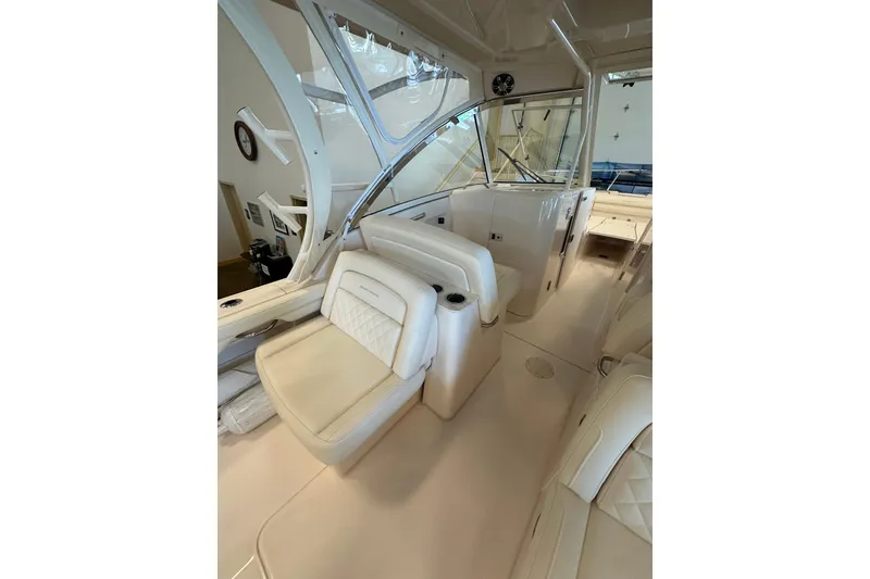 Slide: The Image of 2019 Grady-White Freedom 325 boat interior with luxurious seating and helm. - 8
