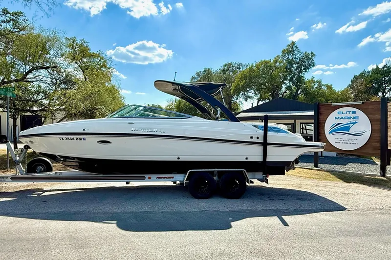 Slide: The Image of 2011 Rinker 276 Captiva boat on trailer at Elite Marine dealership. - 0