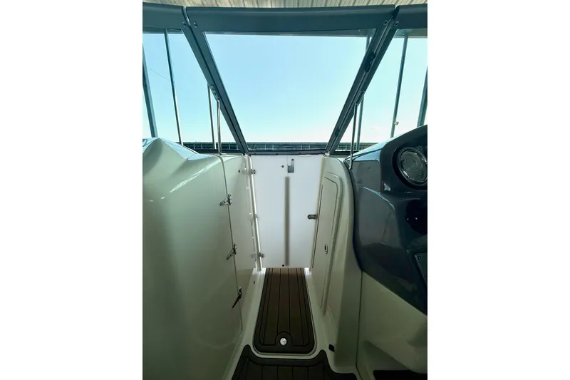 Slide: The Image of 2011 Rinker 276 Captiva boat interior with sleek design and modern dashboard. - 30