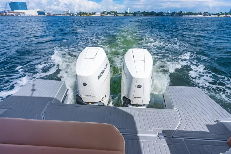 Slide: The Image of 2024 Cruisers Yachts 34 GLS OB with twin Mercury outboard engines on open water. - 18