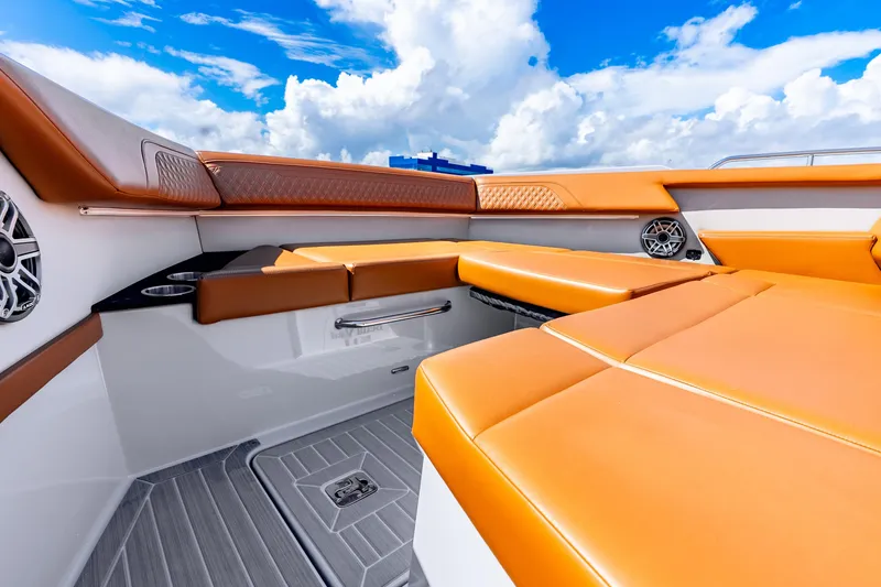 Slide: The Image of 2024 Cruisers Yachts 34 GLS OB interior with orange seating and modern design. - 25