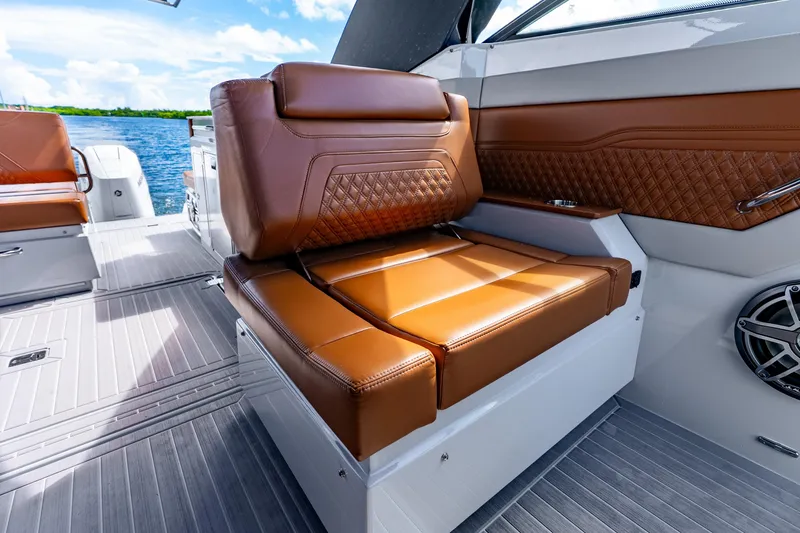 Slide: The Image of Luxurious brown leather seating on 2024 Cruisers Yachts 34 GLS OB boat interior. - 34