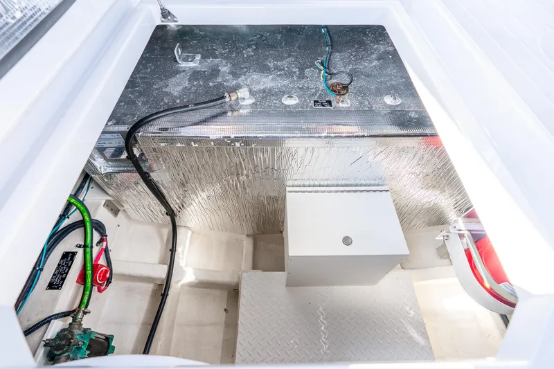 Slide: The Image of 2024 Cruisers Yachts 34 GLS OB engine compartment with wiring and components. - 39