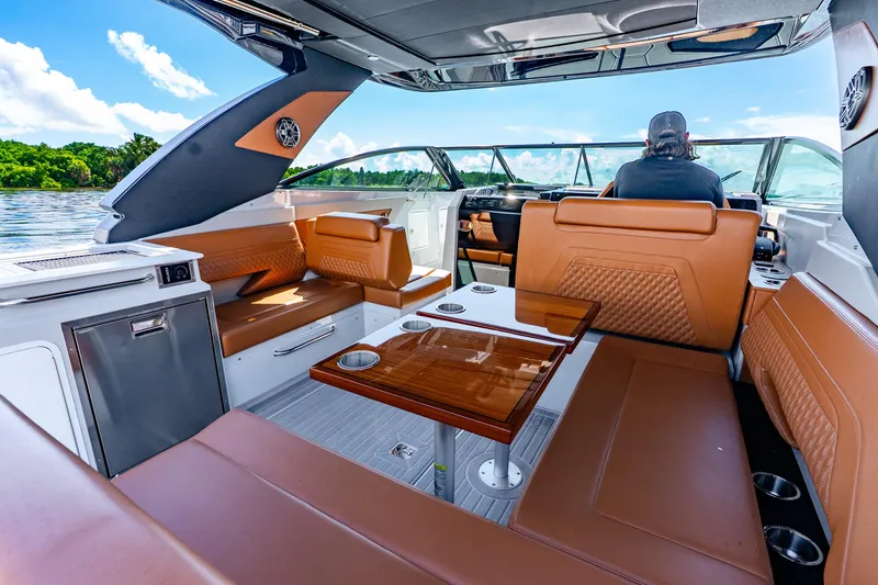 Slide: The Image of Luxurious interior of 2024 Cruisers Yachts 34 GLS OB with leather seating and modern amenities. - 9