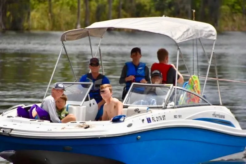 Slide: The Image of 2020 Hurricane SunDeck 191 OB boat with passengers enjoying a sunny day on the water. - 5
