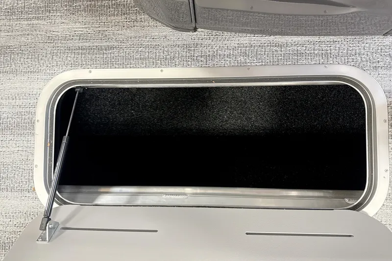 Slide: The Image of Open storage compartment in 2026 Bennington 24 MSB boat, featuring sleek design and durable materials. - 10