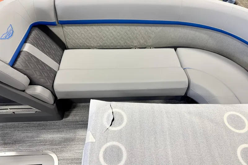 Slide: The Image of 2026 Bennington 24 MSB boat interior with gray seating and blue accents. - 7