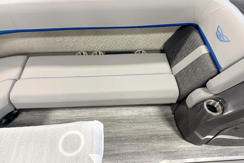 Slide: The Image of 2026 Bennington 24 MSB boat interior with gray seating and blue accents. - 8