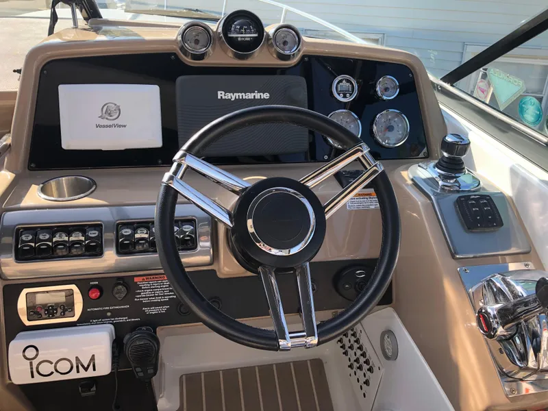 Slide: The Image of 2013 Formula 350 Sun Sport dashboard with steering wheel and navigation controls. - 10