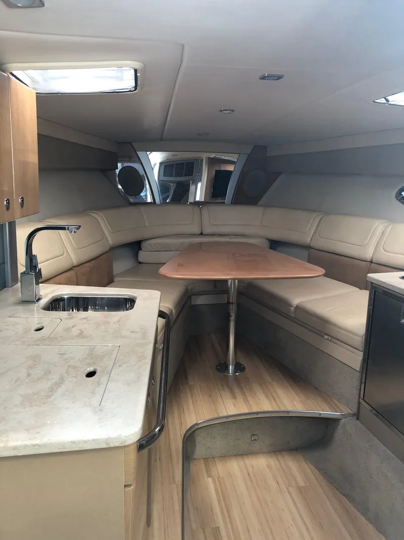 Slide: The Image of Interior of 2013 Formula 350 Sun Sport boat with seating and kitchenette. - 12