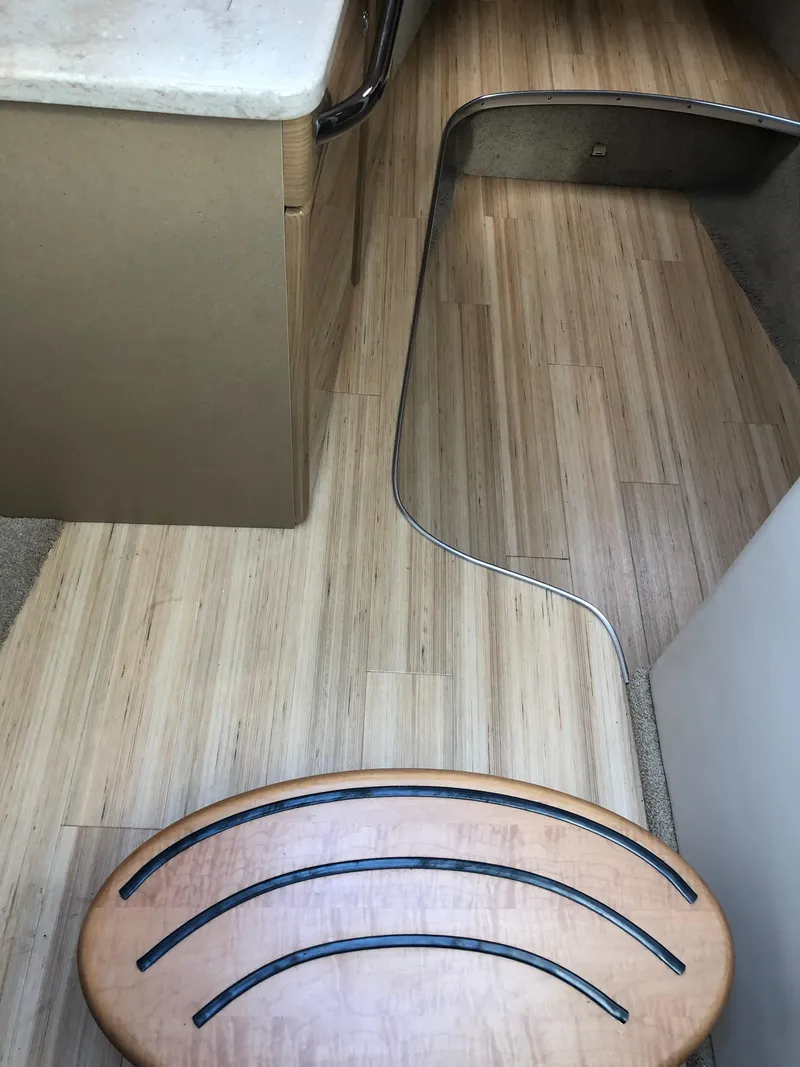 Slide: The Image of 2013 Formula 350 Sun Sport interior with wooden flooring and curved design elements. - 13
