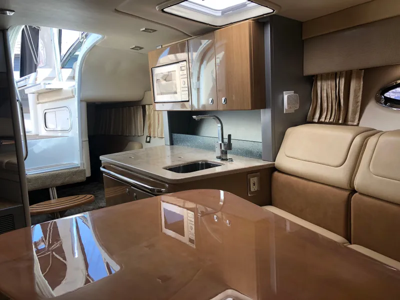 Slide: The Image of Luxurious interior of a 2013 Formula 350 Sun Sport boat with modern kitchen amenities. - 19