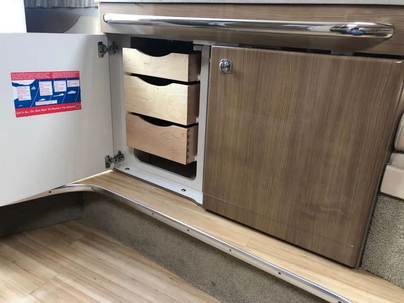 Slide: The Image of 2013 Formula 350 Sun Sport interior cabinet with open wooden drawers and sleek design. - 21