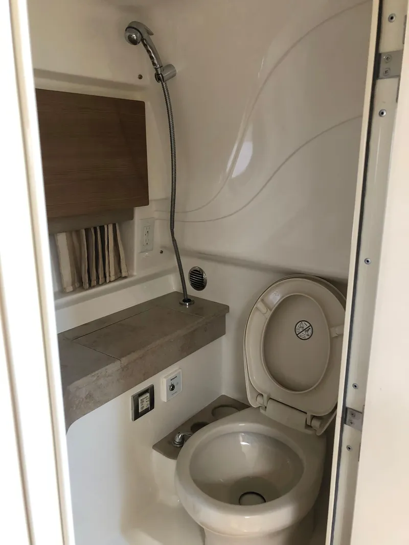 Slide: The Image of 2013 Formula 350 Sun Sport bathroom with shower and toilet, compact and efficient design. - 25