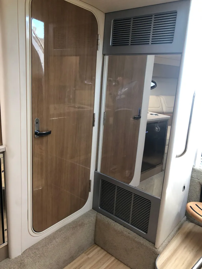 Slide: The Image of 2013 Formula 350 Sun Sport cabin interior with wooden door and modern design elements. - 27