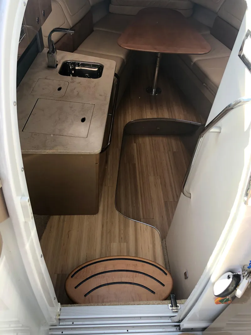 Slide: The Image of Interior of 2013 Formula 350 Sun Sport boat with wood flooring and seating area. - 29