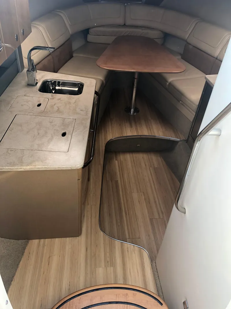 Slide: The Image of 2013 Formula 350 Sun Sport cabin interior with kitchenette and seating area. - 30