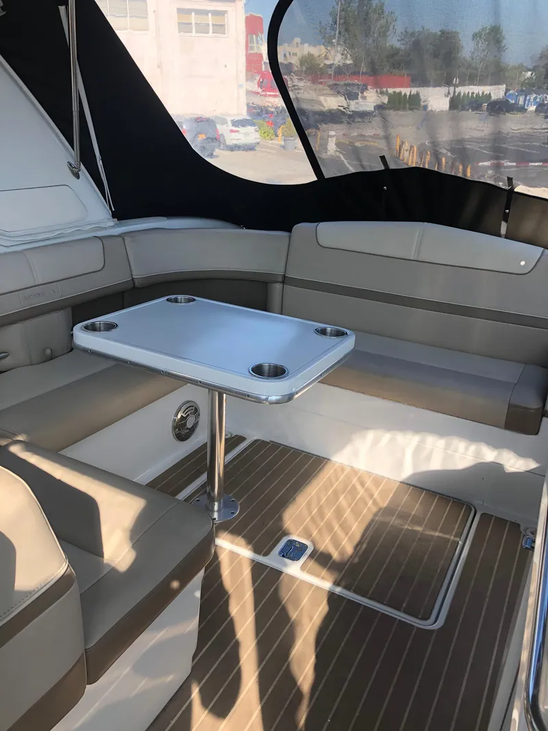 Slide: The Image of 2013 Formula 350 Sun Sport boat interior with seating and table. - 31