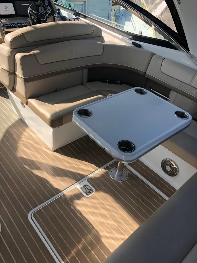 Slide: The Image of 2013 Formula 350 Sun Sport interior with seating and table, featuring elegant design and wood flooring. - 32